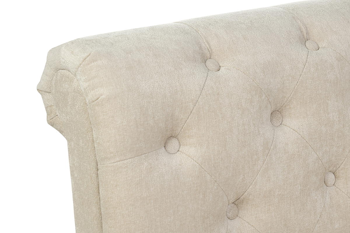 T�te de lit beige capitonn�e en velours, vue de d�tail sur les boutons.