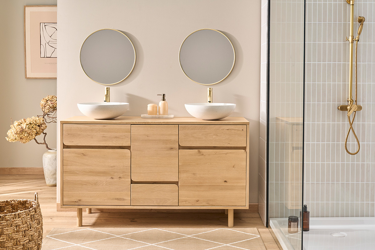 Vasque ronde en terrazzo gris D40 cm LAORA sur un meuble en bois, vue de face.